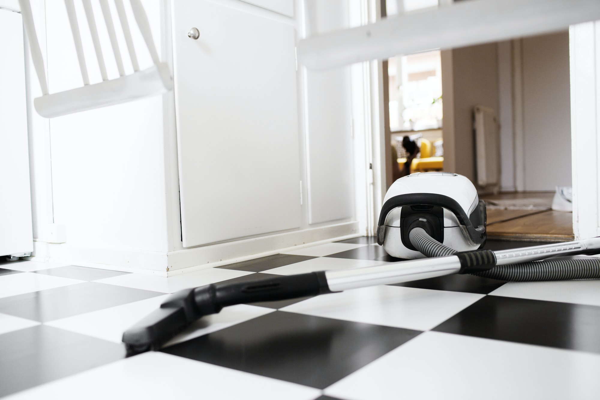 Vacuum cleaner on tiled floor Vacuum cleaner on tiled floor